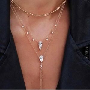 Multi-layered crystal necklace with tasseled pendant